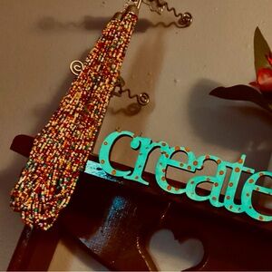 Multi colored beaded necklace bought from a storage unit w other jewelry.